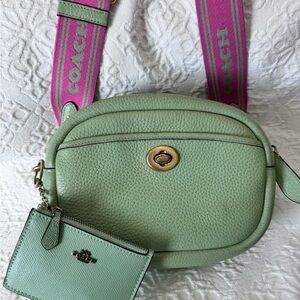 Pistachio Coach Camera Bag with Pink Strap and matching Mini Wallet.